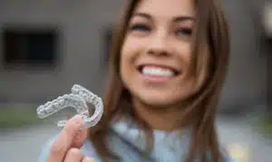 Clear orthodontic retainer placed in protective case