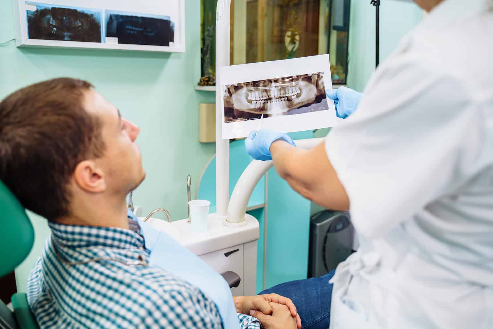 Adult patient discussing bite correction and jaw alignment in Roseville CA